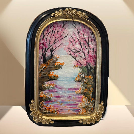 Decorative painting of a cherry blossom garden with a black and gold frame.