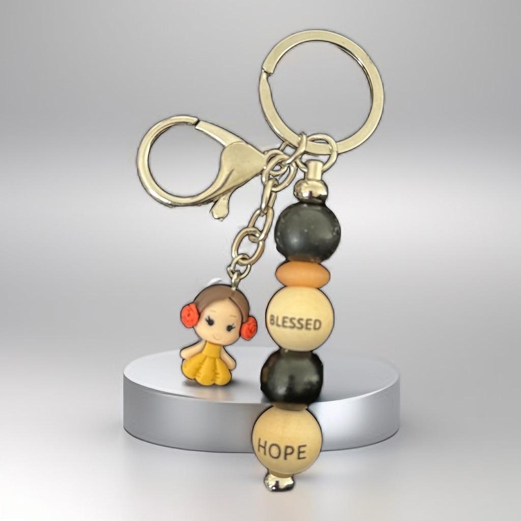 "Handmade Inspirational Beaded Keychain with Cute Doll Charm – ‘Blessed & Hope’ Design"