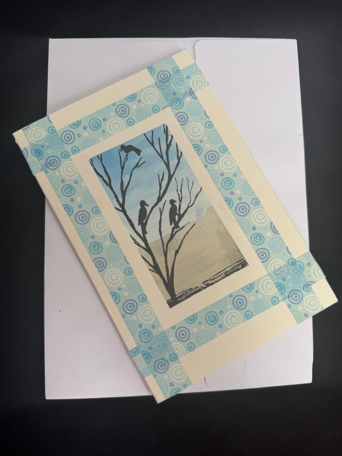 Greeting card with nature-themed design on a white envelope