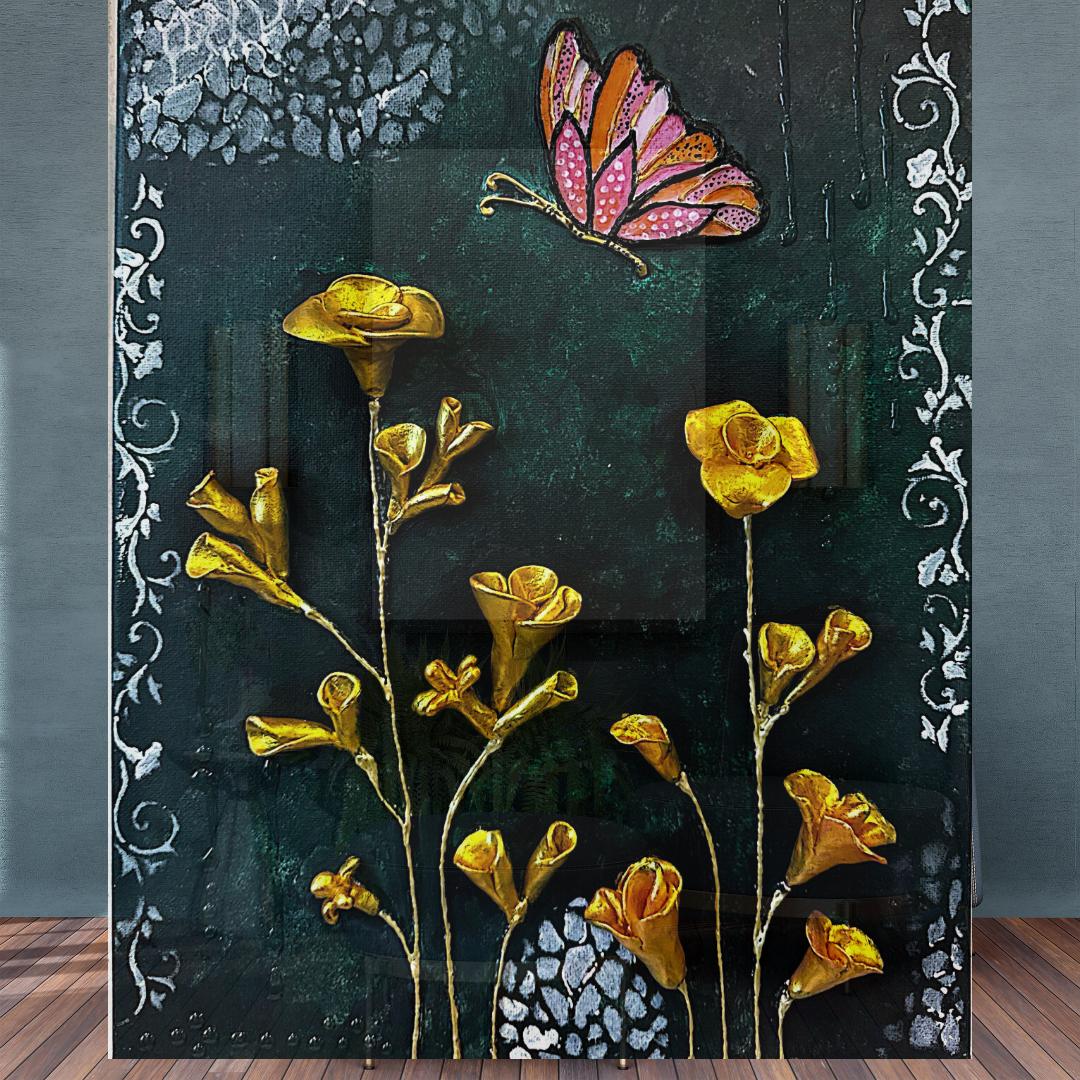 Decorative wall art with gold flowers and a butterfly on a dark background