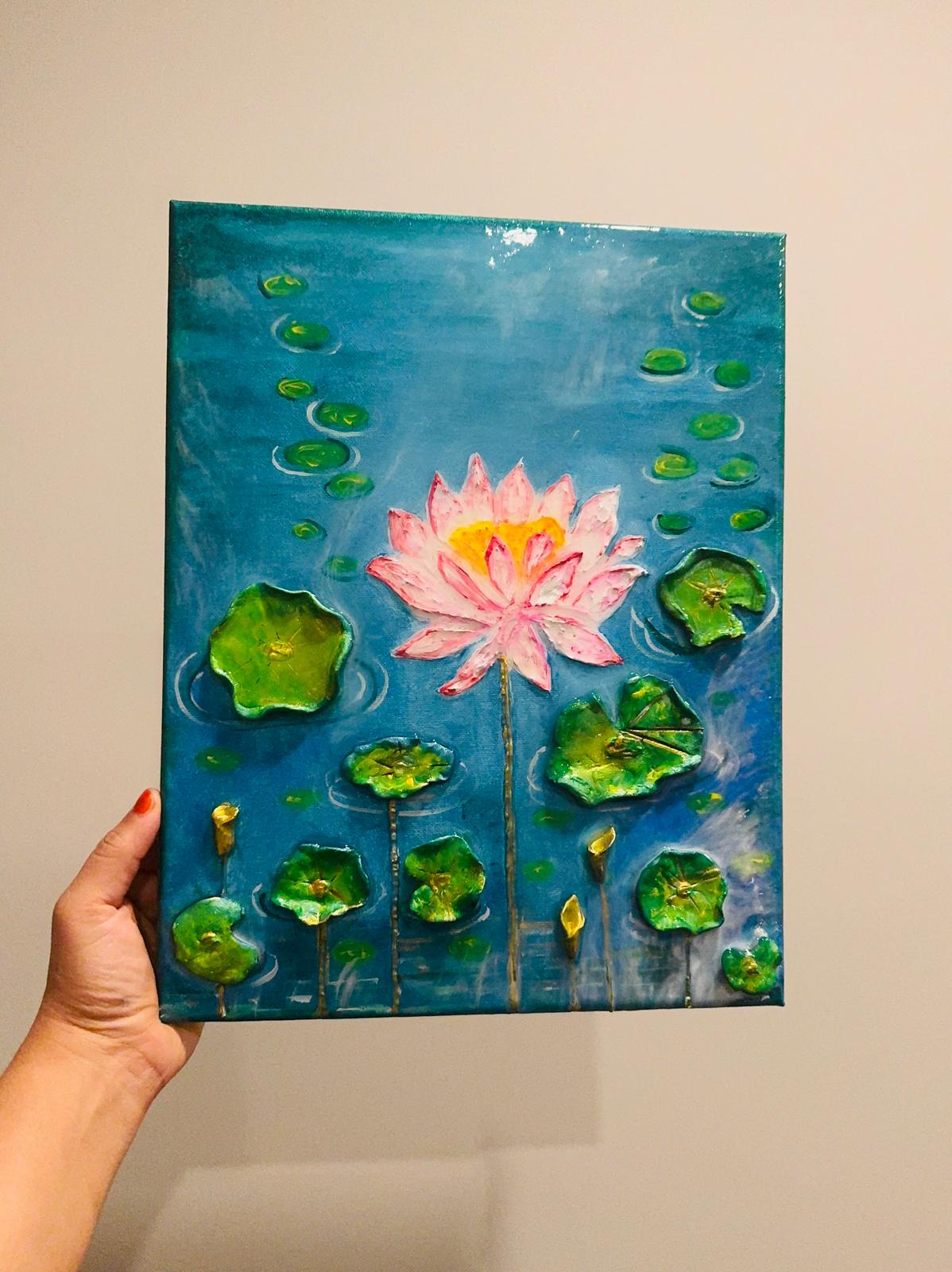 Handcrafted 3D lotus flower painting featuring a pink lotus bloom, raised green lily pads, and a glossy resin finish on a blue water background, 11x14 inches.