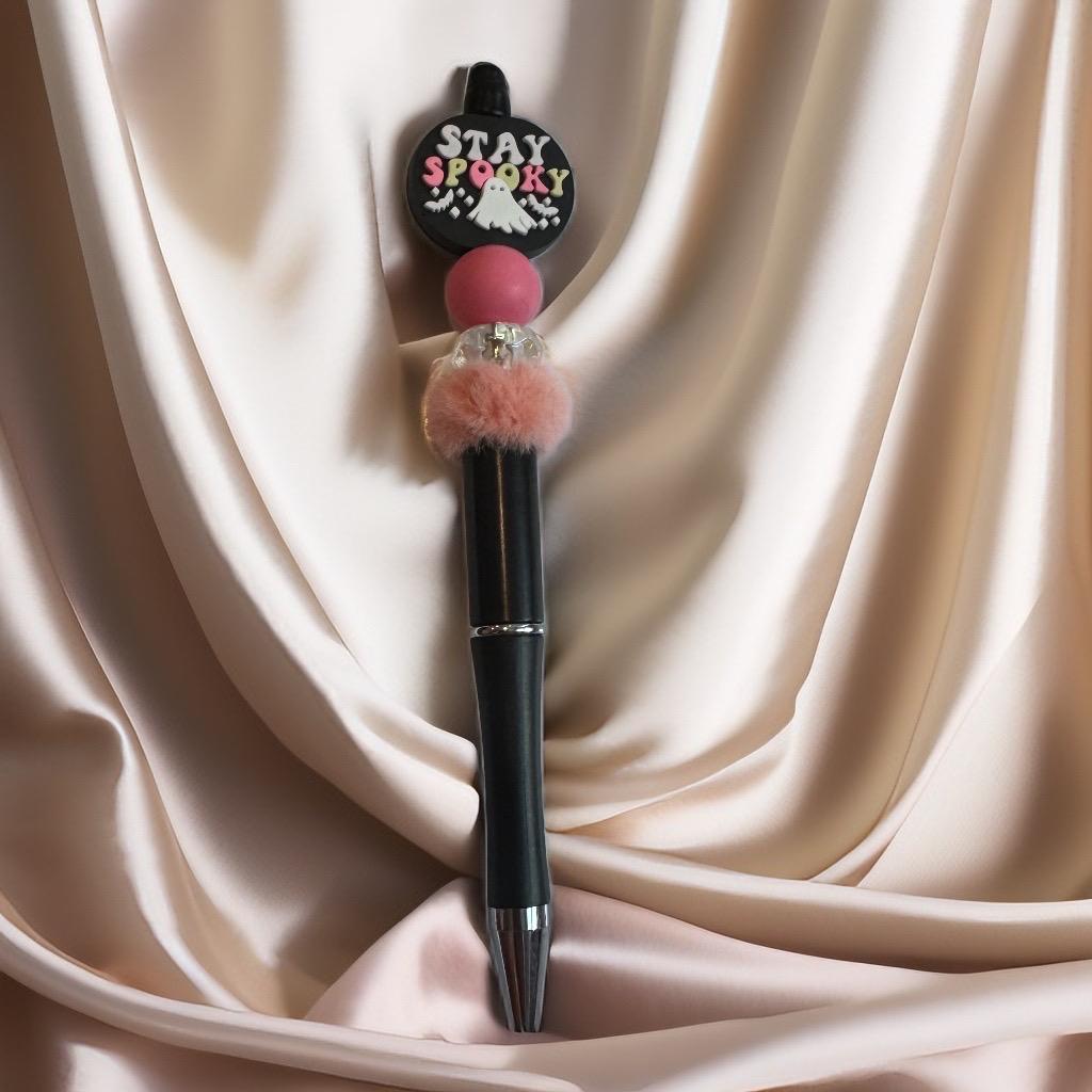 Pen with decorative charm 