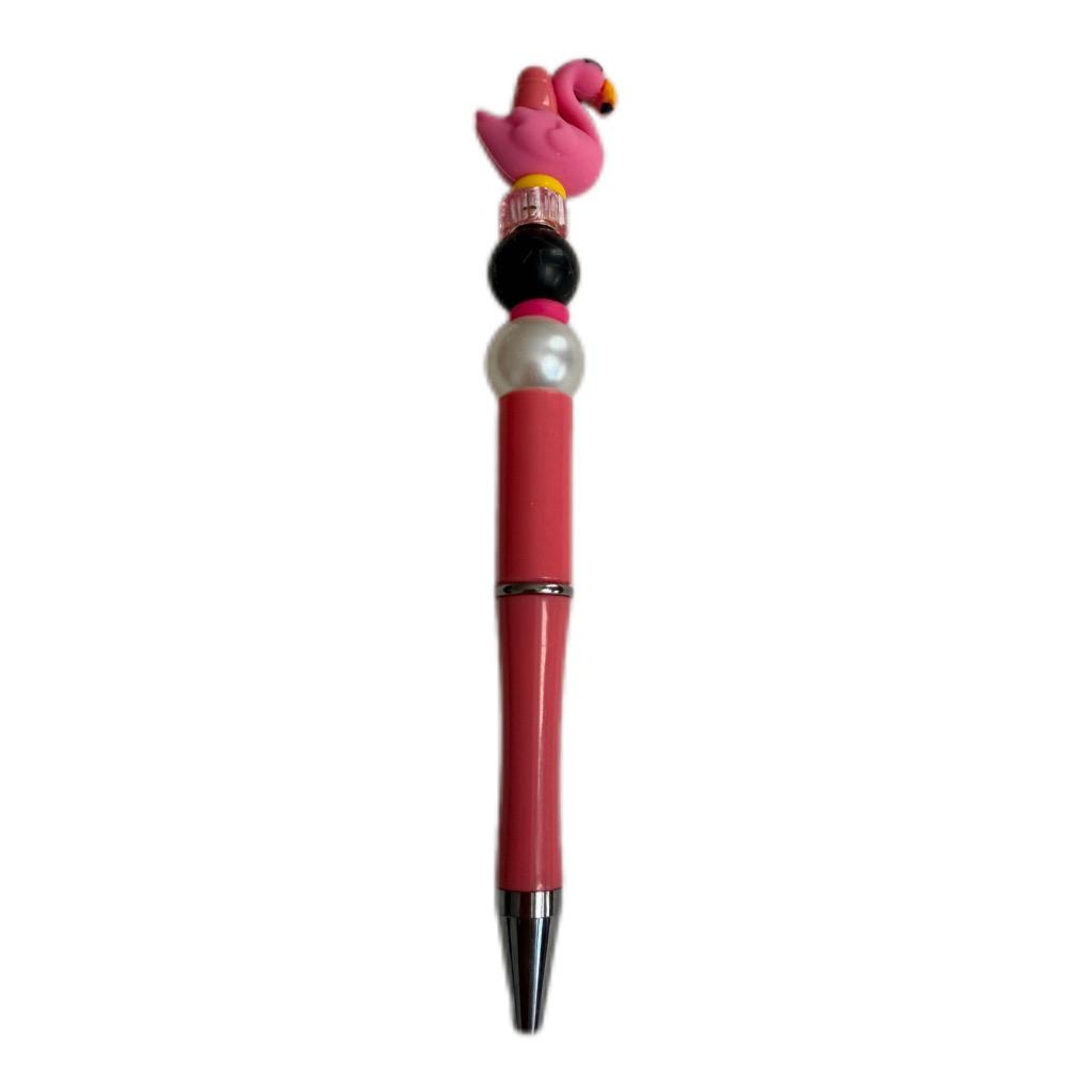 Hand beaded Pen with a pink flamingo-shaped top.