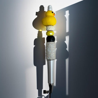 Handmade beaded pen with a cute yellow duck topper and sparkly crystal beads on a silver ballpoint pen.