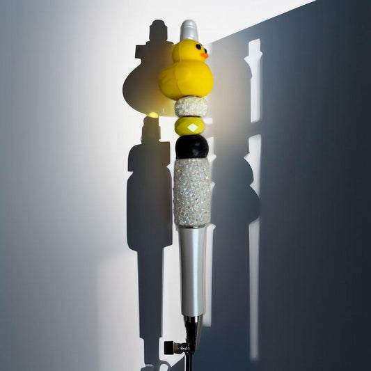 Handmade beaded pen with a cute yellow duck topper and sparkly crystal beads on a silver ballpoint pen.