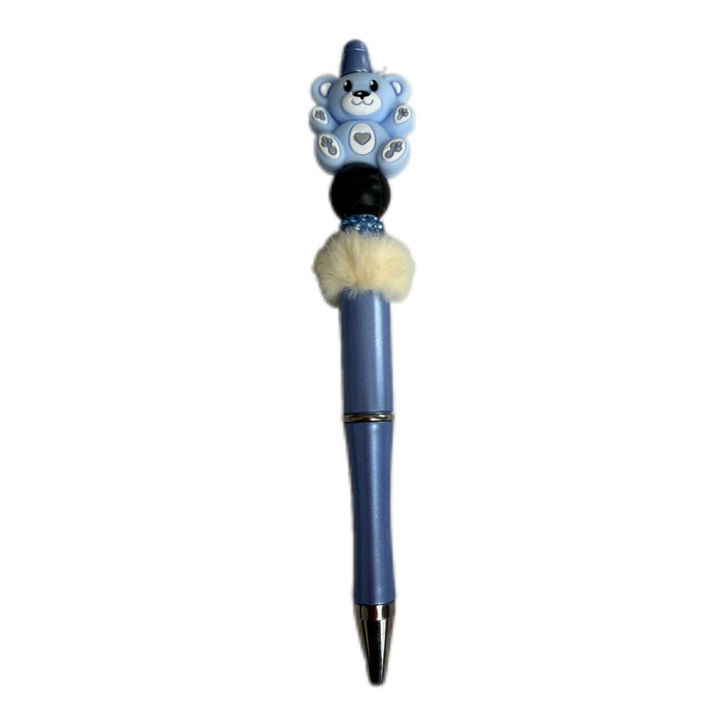 Handmade blue beaded pen with bear character topper, soft fur bead detail, and blue ballpoint pen body.