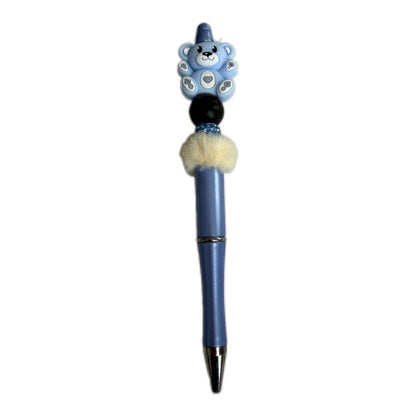 Handmade blue beaded pen with bear character topper, soft fur bead detail, and blue ballpoint pen body.