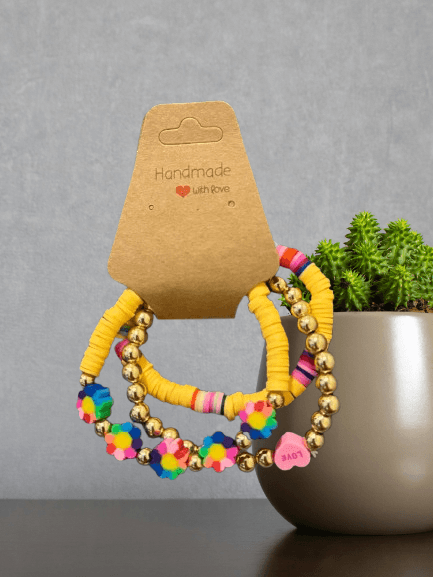 Golden Bloom Bracelet Stack – Handmade Yellow Beads with Flower & LOVE Charms