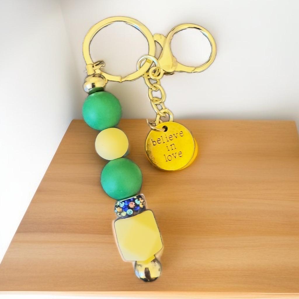 Green and Yellow Beaded Keychain with "Believe in Love" Charm