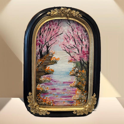 Decorative painting of a cherry blossom garden with a black and gold frame.