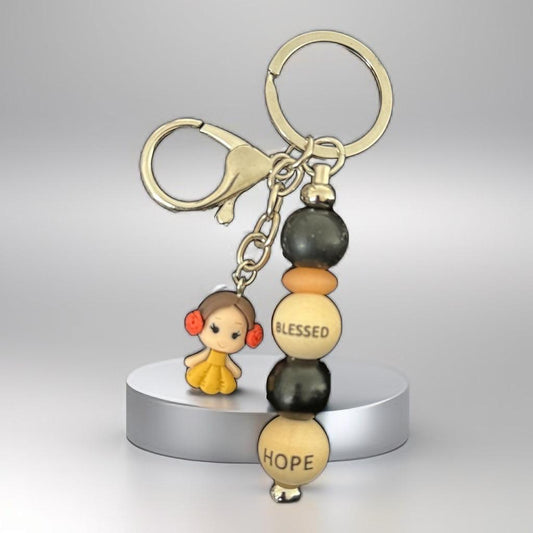 "Handmade Inspirational Beaded Keychain with Cute Doll Charm – ‘Blessed & Hope’ Design"