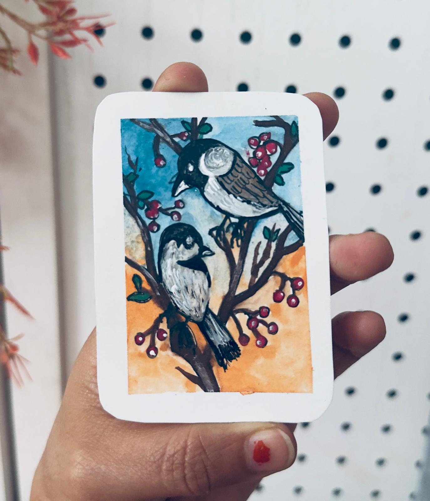 Hand-painted ACEO mini art card featuring two brown and black birds on a branch with red berries against a warm sky background.