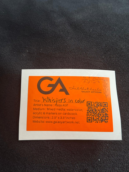 Orange and white business card with 'GA' logo on a dark surface