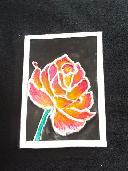 Hand-painted ACEO card of glowing orange-pink rose on black background.