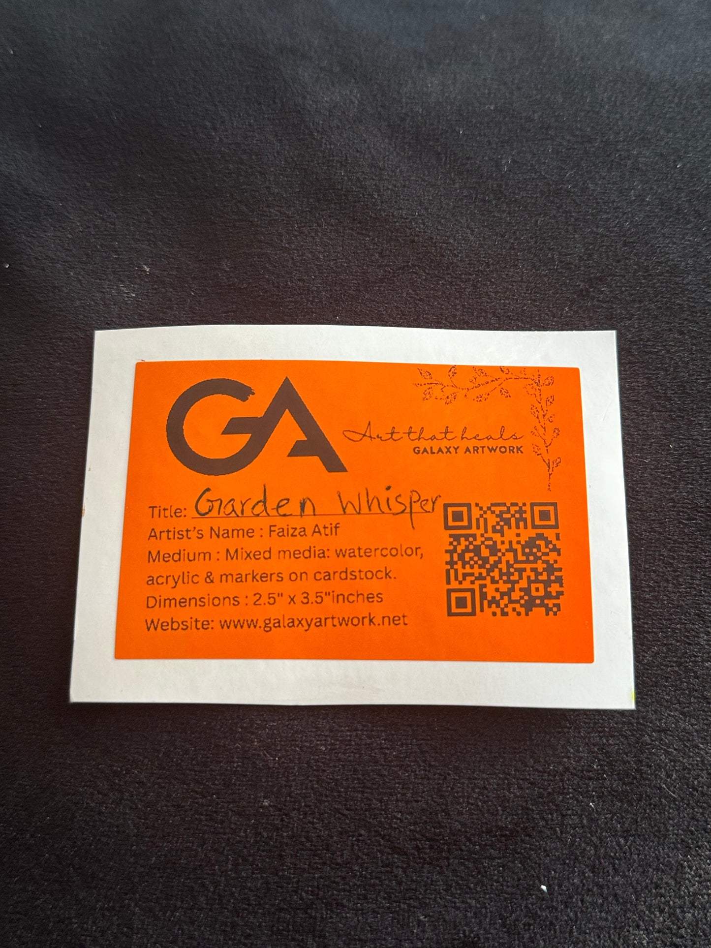 Orange and white business card with 'GA' logo on a dark background