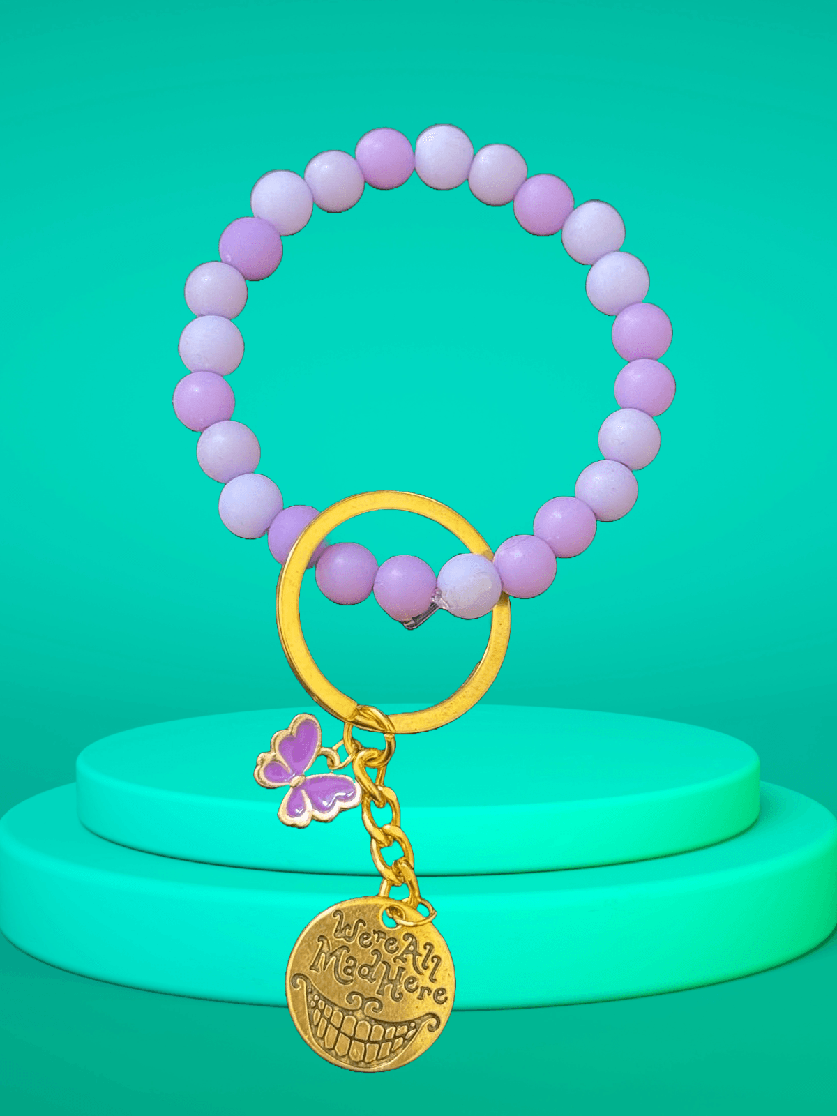 Mad Wonderland Keychain – Pastel Purple Beads with “We’re All Mad Here” Charm