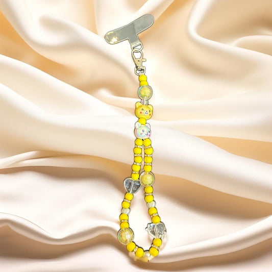 Handmade beaded mobile charm in soft  tones with bear, butterfly, and flower beads, finished with clear crystal accents, by Galaxy Artwork.