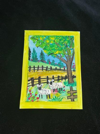 Handmade card with a pastoral scene of sheep under a tree