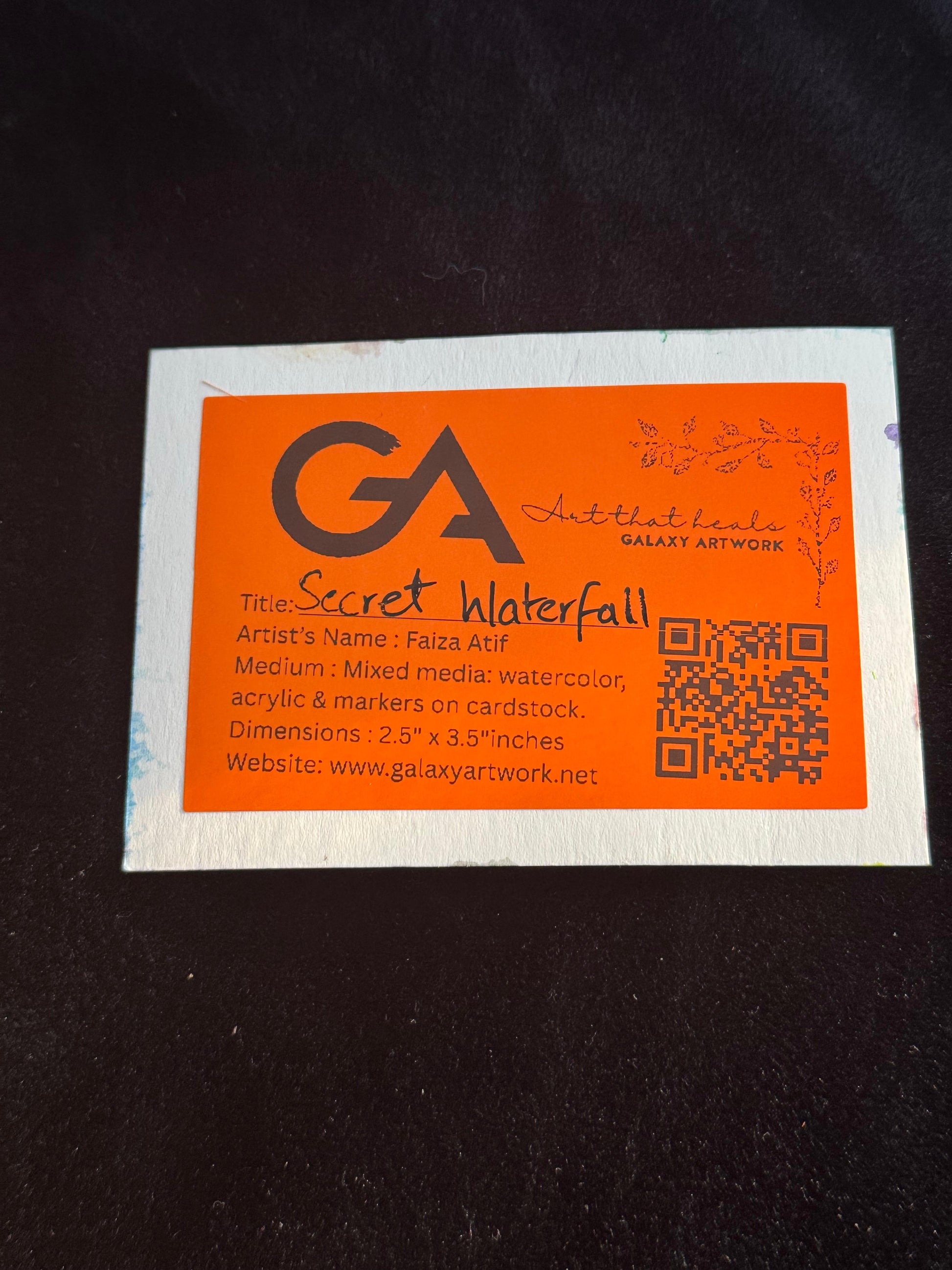 Orange and white business card with 'GA' logo and text on a dark background