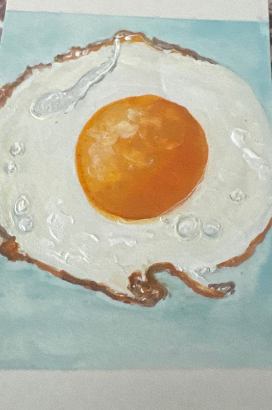 Hand-painted ACEO card of sunny side up fried egg with textured detail.