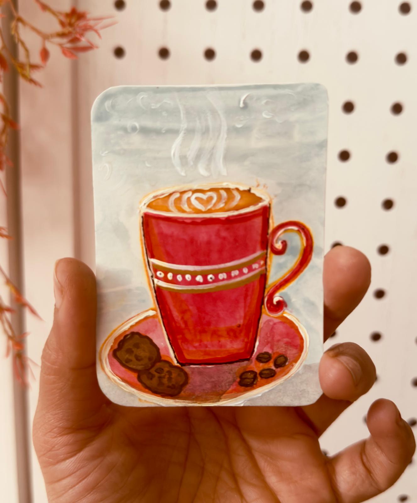 Hand-painted ACEO card of red coffee cup with steam, cookies, and beans on saucer.