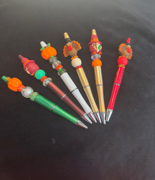 Set of decorative pens with colorful beads for fall theme