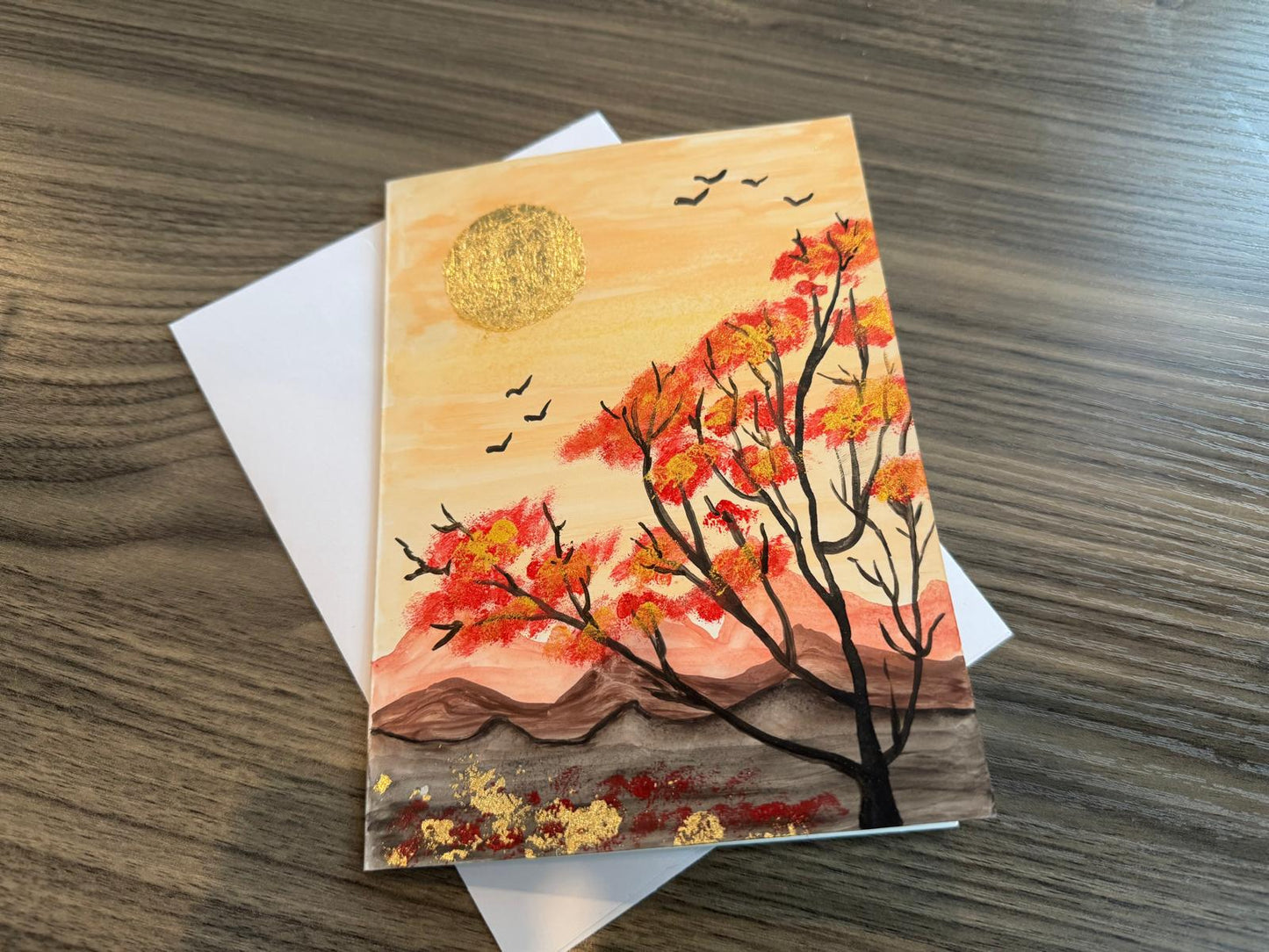 Card with a nature design featuring a bird over water and moon