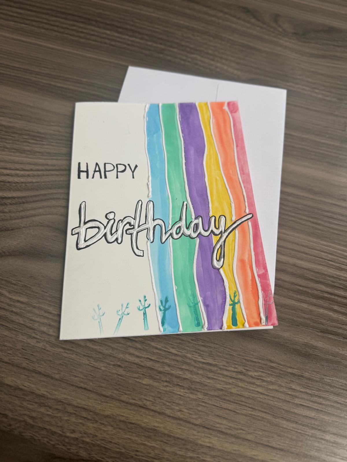 Hand made Birthday card with colorful stripes and 'Happy Birthday' text 