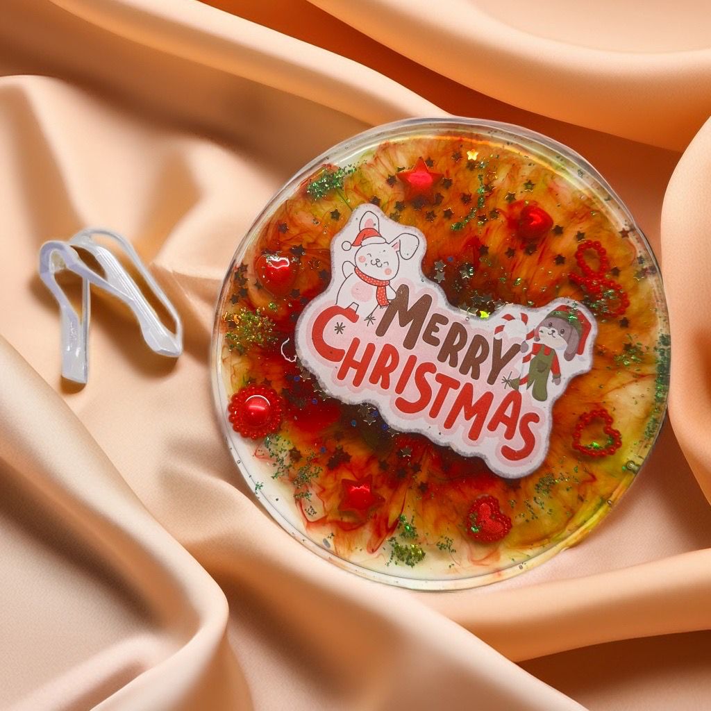 Round decorative coaster with 'Merry Christmas' text.