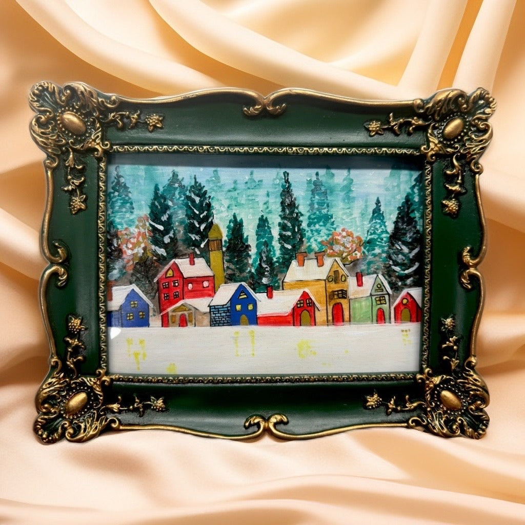 Decorative green and gold frame with a Orignal painting of winter village scene  .