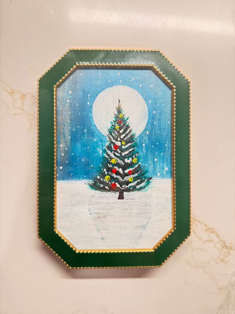 Handmade mini acrylic painting of a Christmas tree under a full moon in a green frame