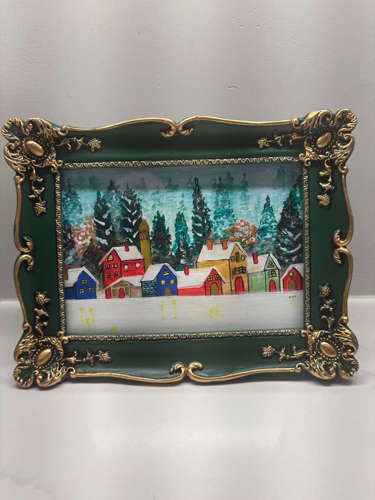 Original painting with Decorative frame with a winter scene of houses and trees.