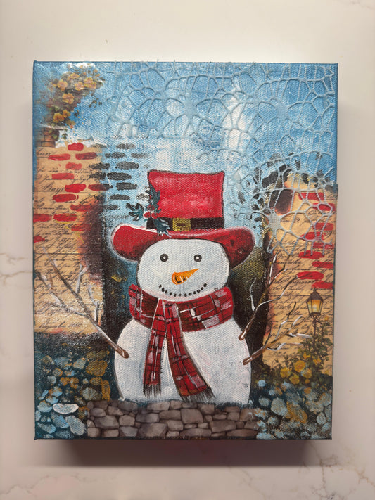 Handmade acrylic painting of a snowman wearing a red hat and scarf with a textured winter brick background.