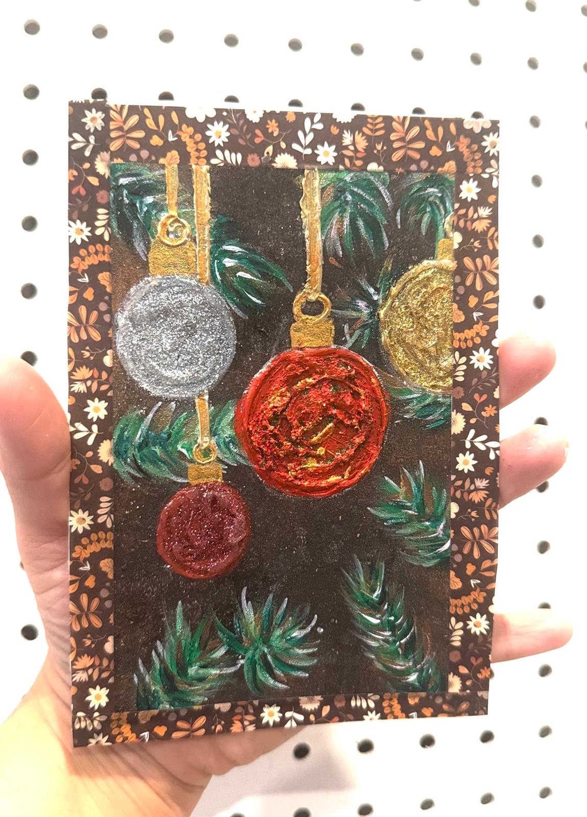 Decorative card with colorful ornaments and floral patterns.