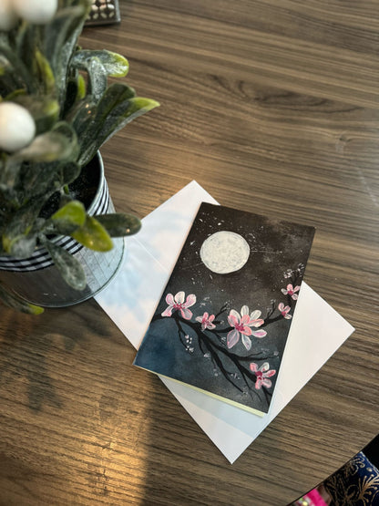 Greeting card with floral design and moon