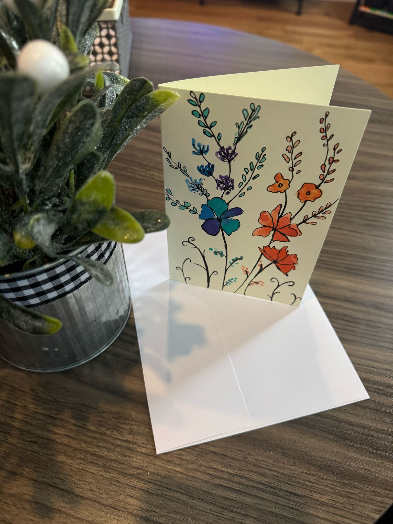 Floral card with a white envelope.