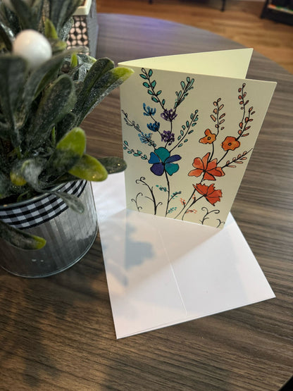 Floral card with a white envelope.