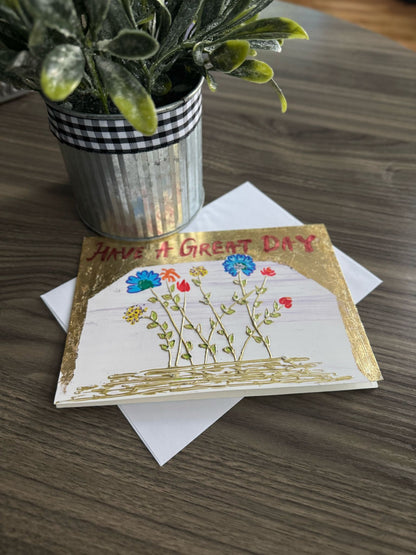 Greeting card with flowers and 'Have a Great Day' text.