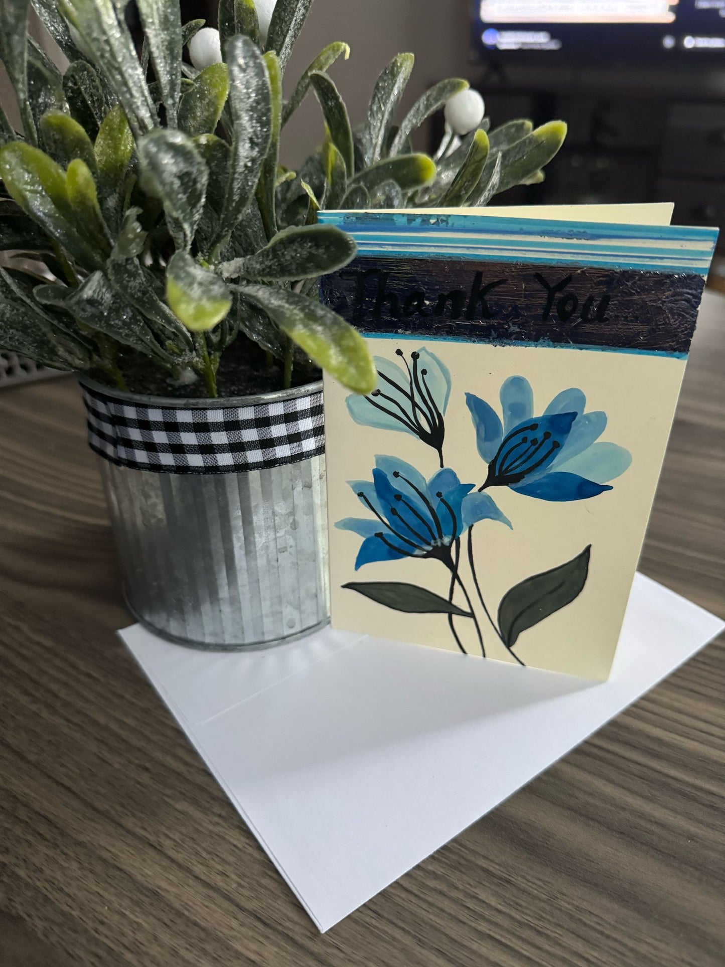 Hand painted 'Thank You' card featuring blue flowers.