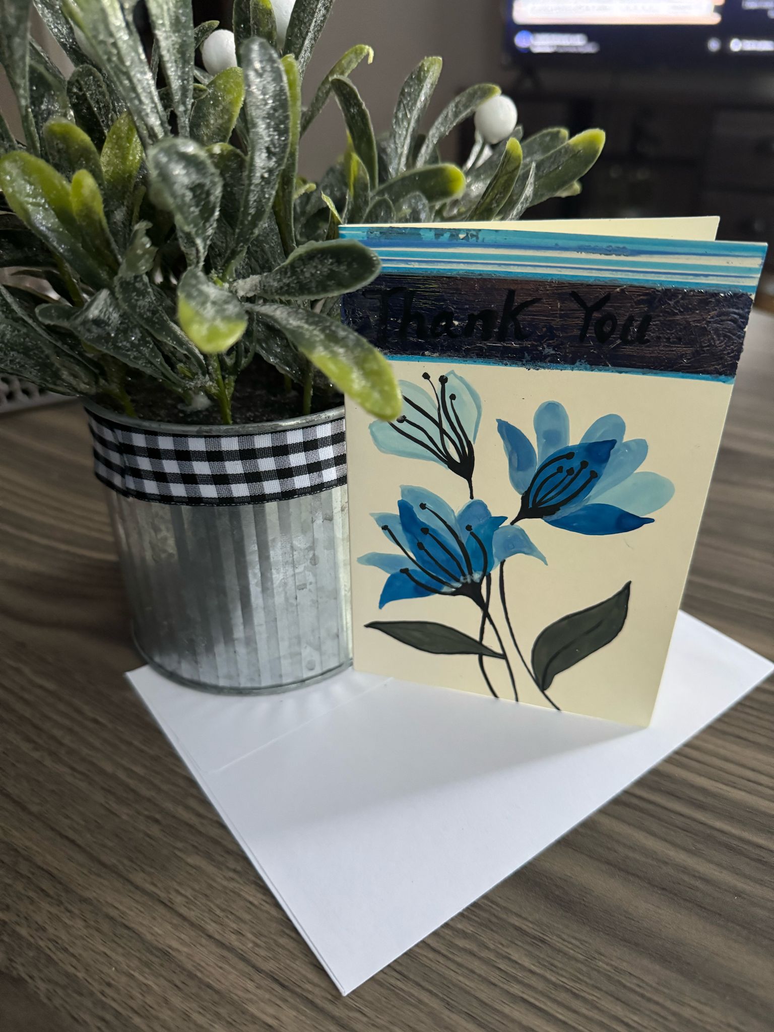 Hand painted 'Thank You' card featuring blue flowers.