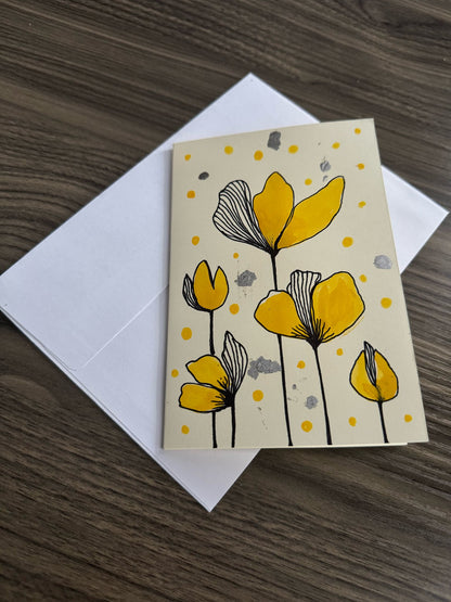 Card with yellow floral design.