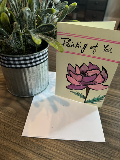 Card with floral design and text 'Thinking of You'