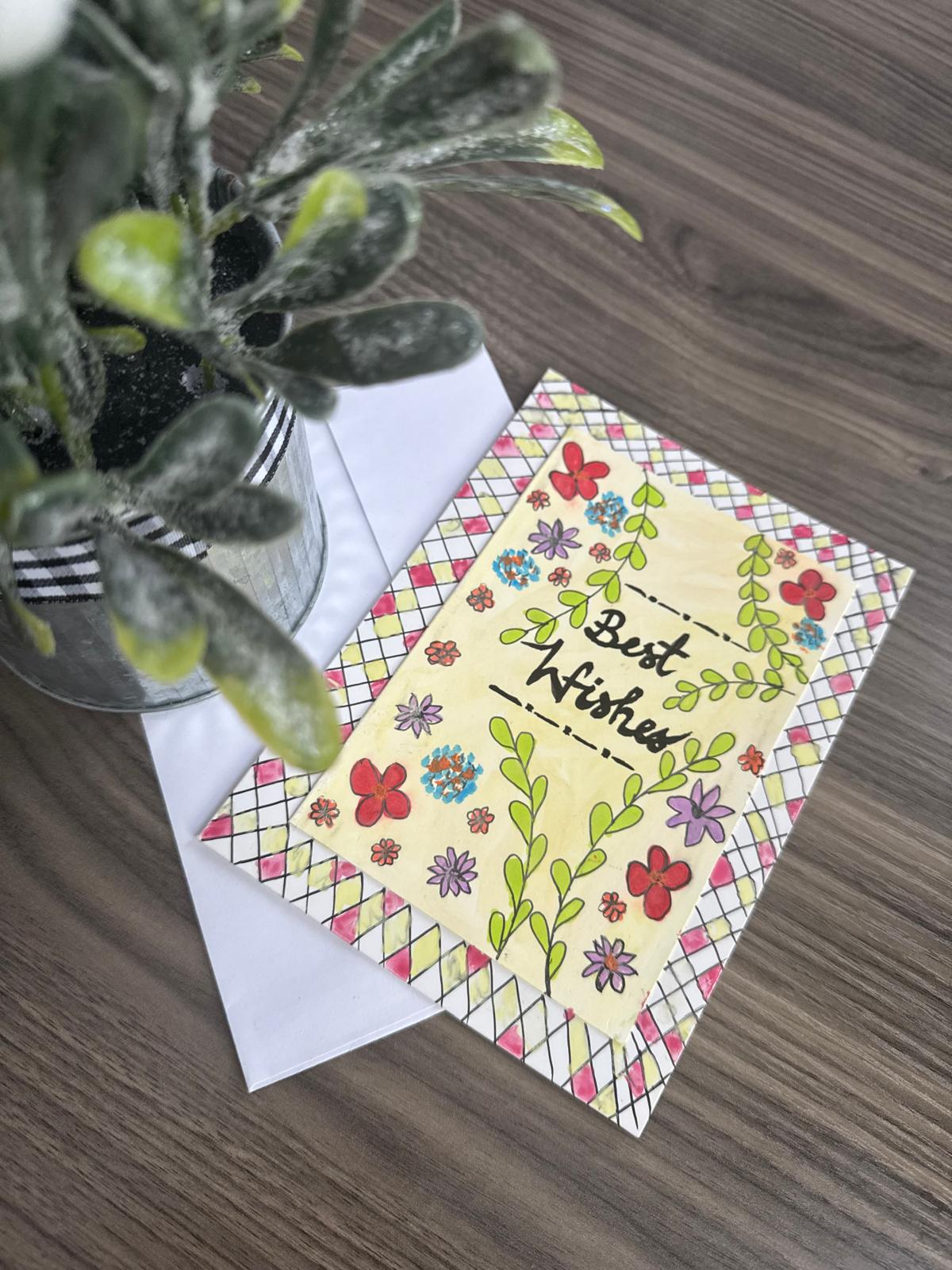 Greeting card with floral design and 'Best Wishes' 