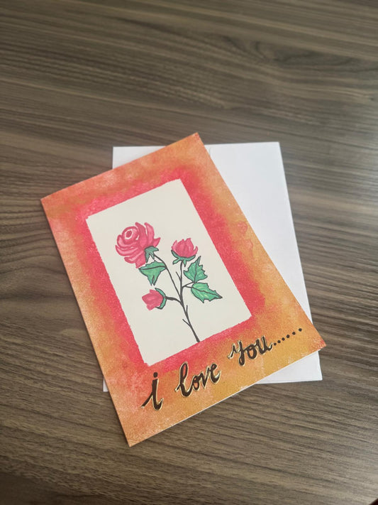 Greeting card with roses and 'I love you' text 