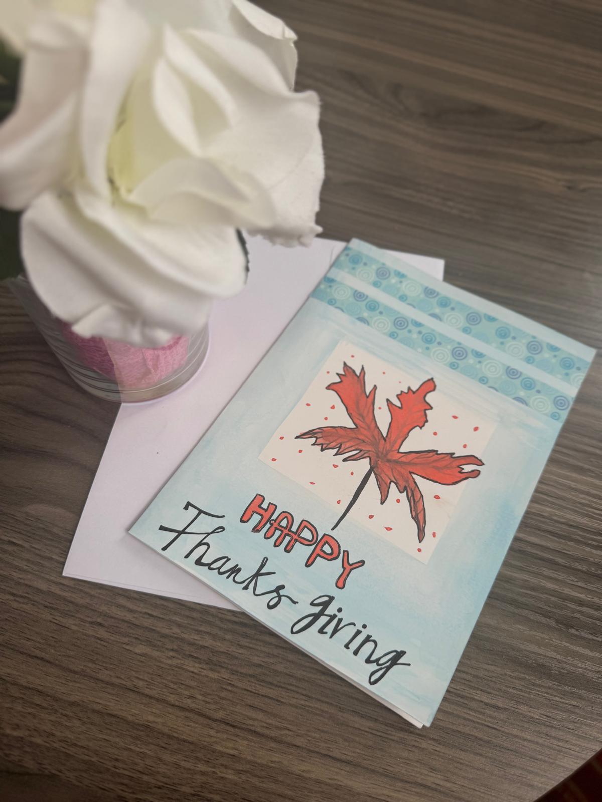 Hand-painted Thanksgiving greeting card with bold fall leaf and Happy Thanksgiving text – blank inside with envelope.