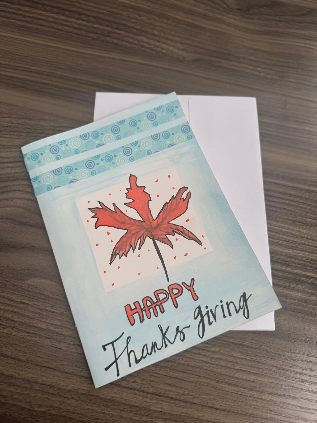 Hand-painted Thanksgiving greeting card with bold fall leaf and Happy Thanksgiving text – blank inside with envelope.
