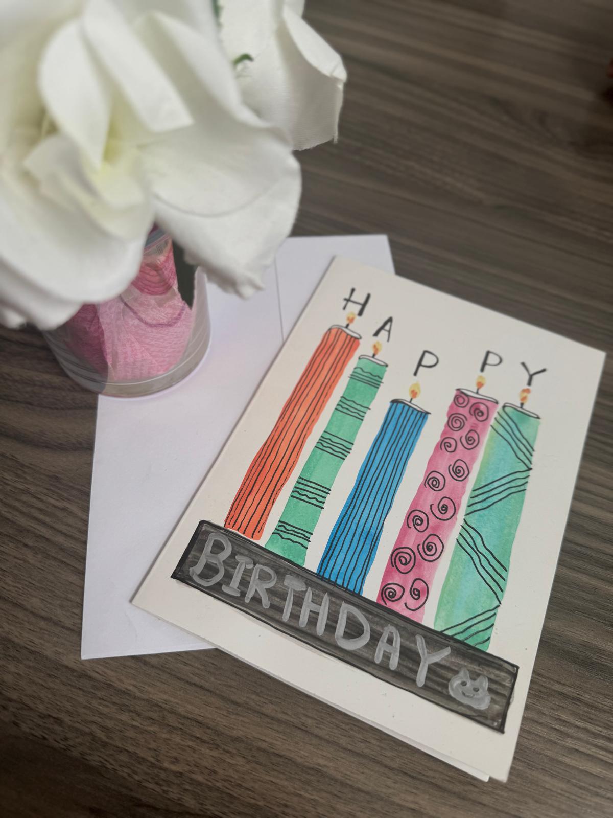 Birthday card with candles and envelope