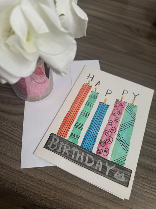 Birthday card with candles and envelope