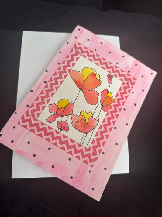 Card with floral design on a pink background