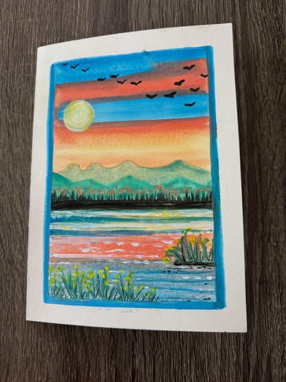 Artistic depiction of a sunset over water with mountains and birds.